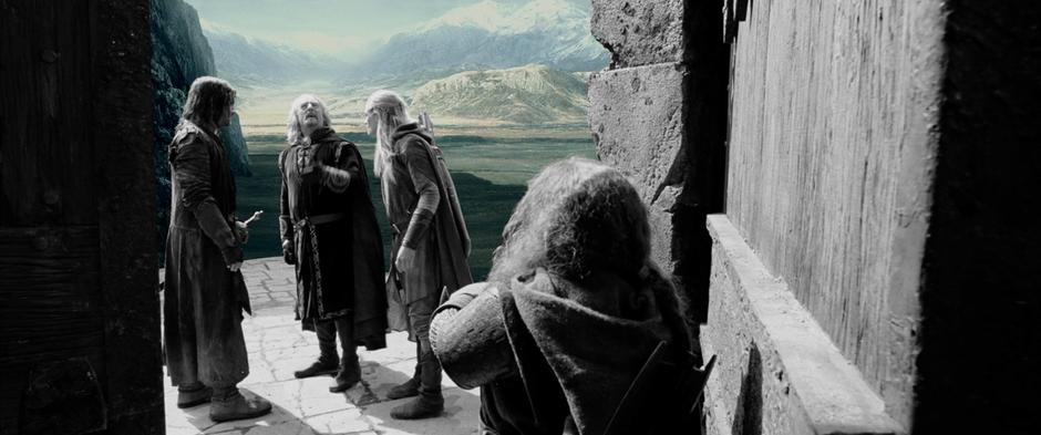 Theoden and the gang discuss the defense of Helm's Deep. Foreground filmed at the Dry Creek Quarry. The hill that Aragorn stands on earlier can be seen in the far background.