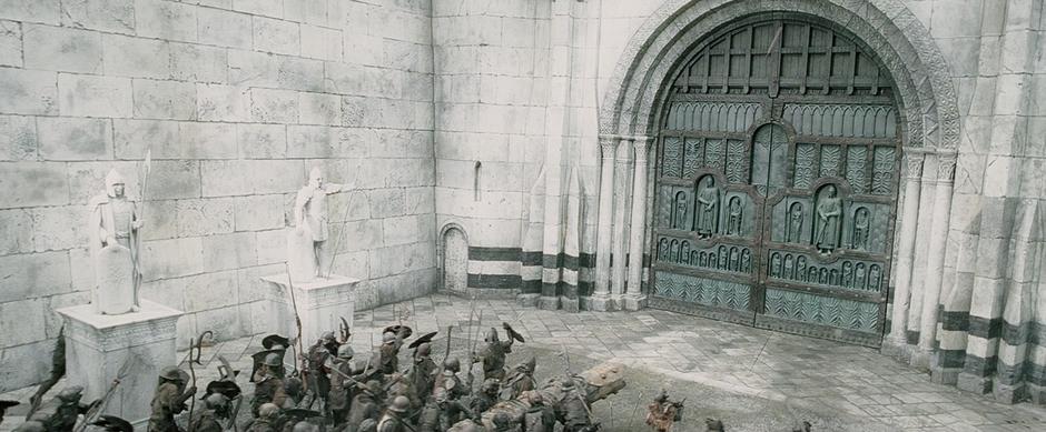 Orcs attack the main gate with a battering ram.