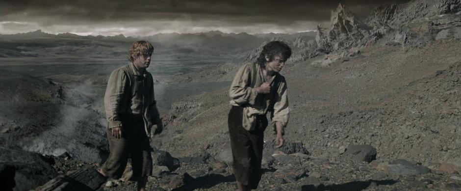 Frodo and Sam struggle up the mountain.