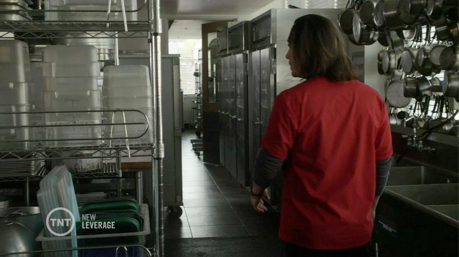 Elliot searches through one of the school's storage rooms for the hidden stash.