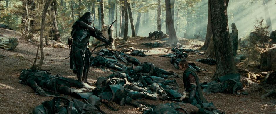 The Uruk-Hai leader Lurtz prepares to shoot a final arrow are Boromir in the final battle.