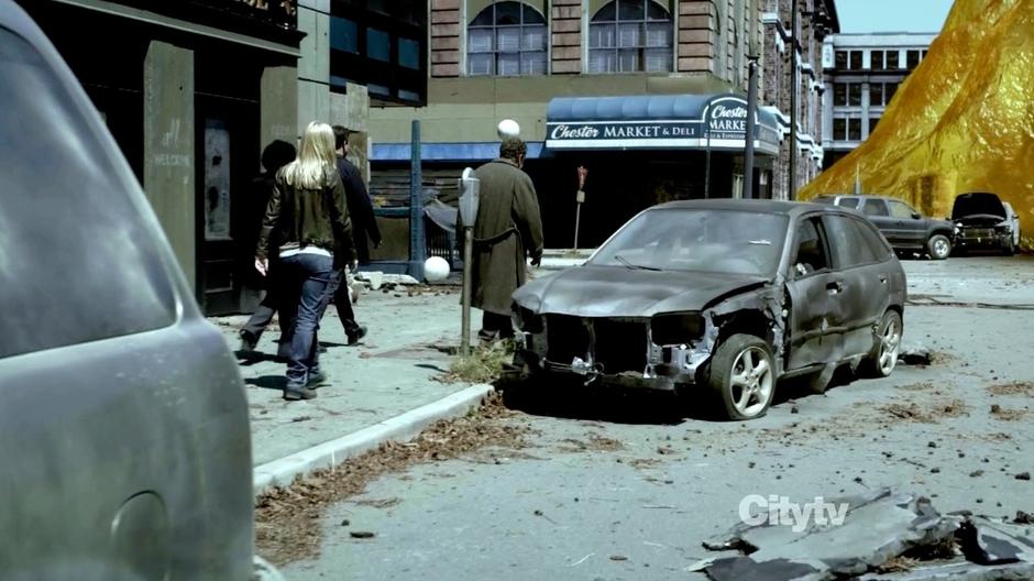 Walter, Peter, Etta, and Astrid walk to where Olivia was trapped in amber.