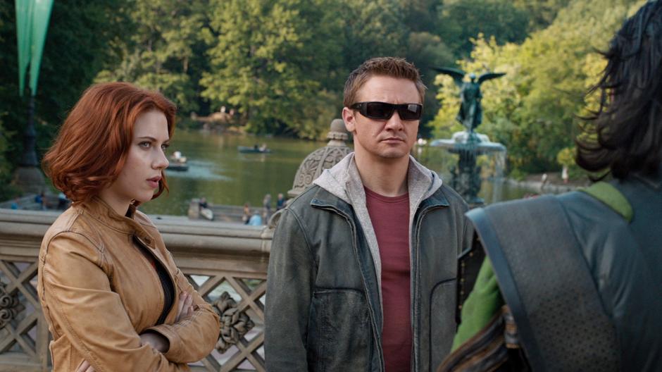 Black Widow and Hawkeye watch as Loki prepares to transport away.