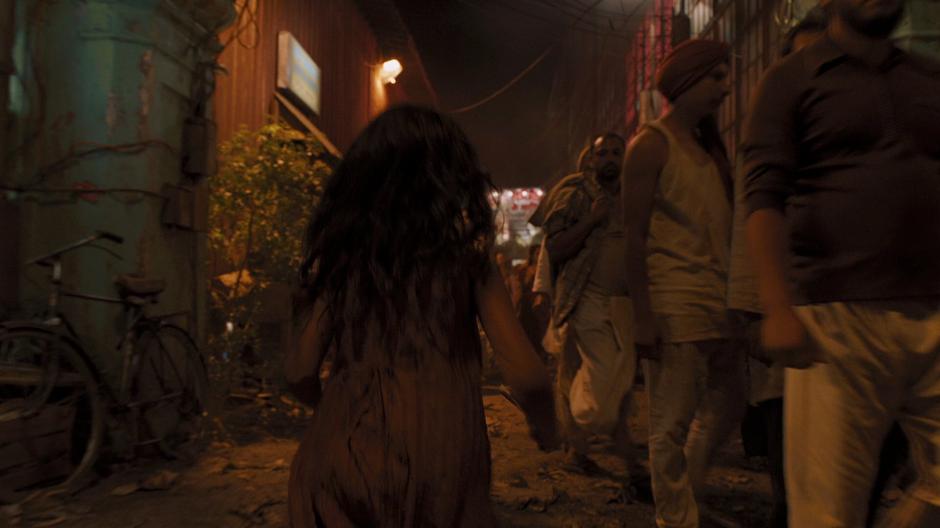 A young girl runs up to where Bruce Banner is looking after a patient.