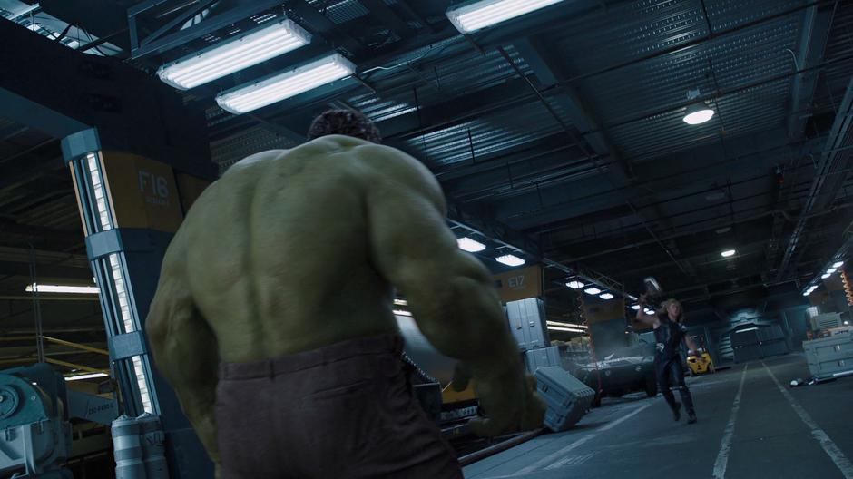 Thor throws his hammer at the rampaging Hulk.