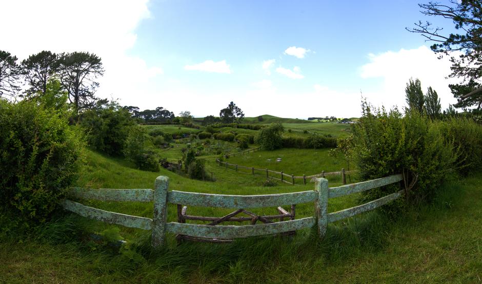 View looking over a fence into a small garden in the lower section of Hobbiton.