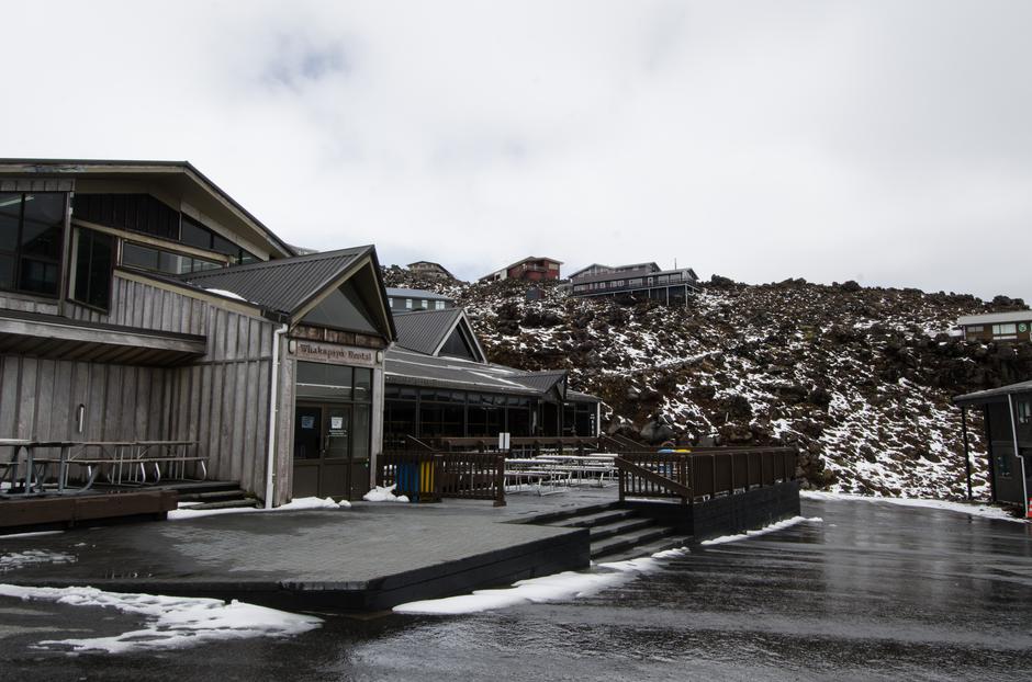 The main lodge at the end of the parking lot.