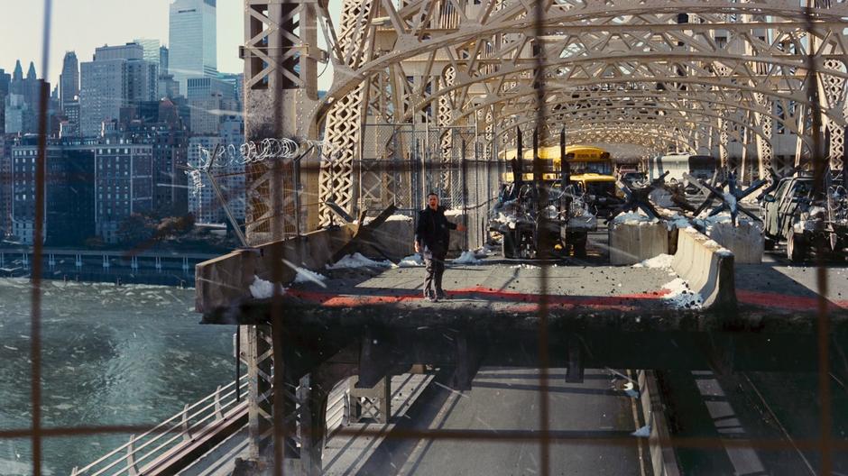 Blake shouts across the the National Guard troops after they blow the bridge.