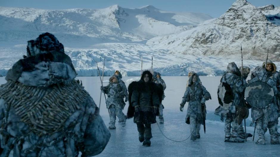 Ygritte escorts to the tied up Jon Snow to the Wildling leader.