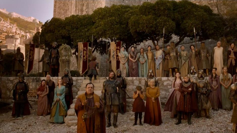 The Lannister family watches their daughter depart the city.