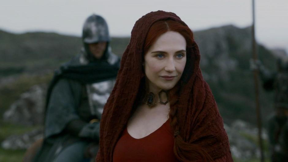 Melisandre gives Renly's group a clever look.