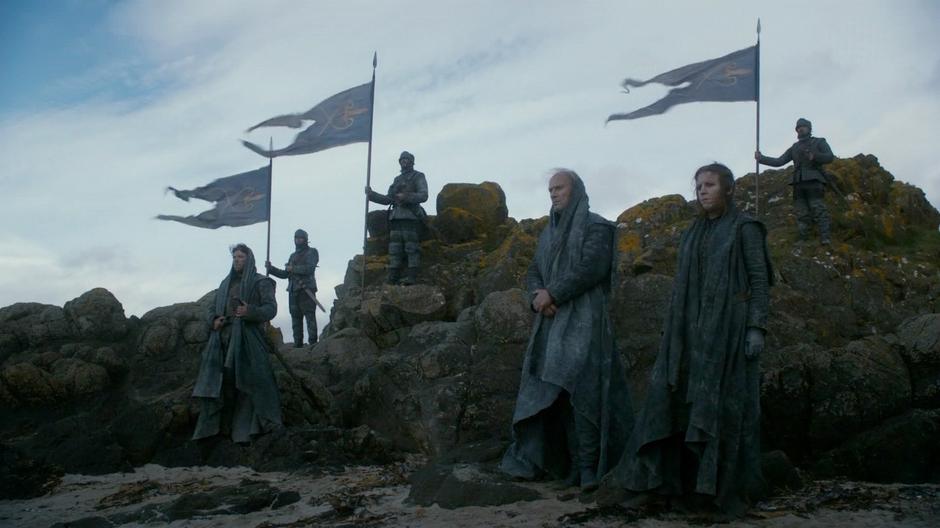 Yara Greyjoy and several other attendants watch during the ceremony.