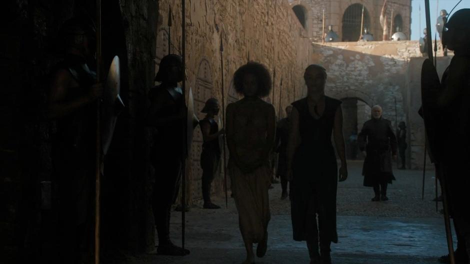 Daenerys and Missandei chat about Missandei's family and future while walking down the street away from the palace.