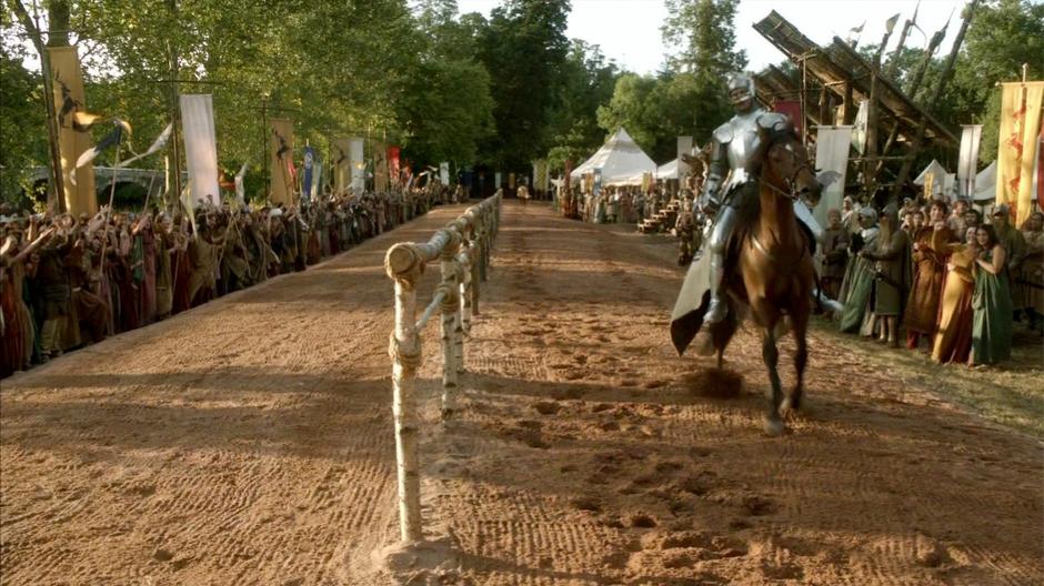 A rider comes to the end of the jousting track in preparation for the run.