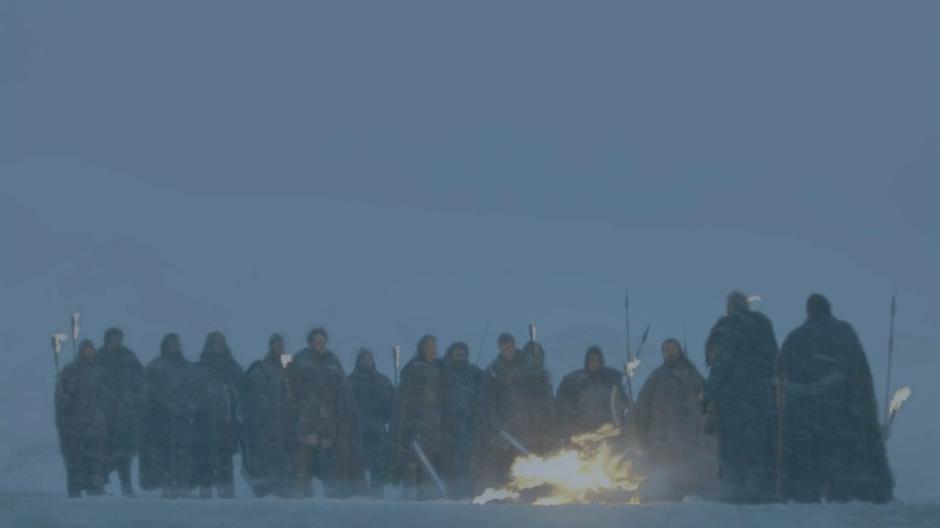 Jeor Mormont address the Night's Watch members while the White Walker burns.