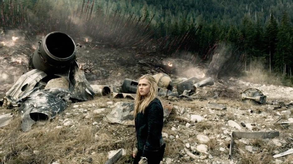 Clarke looks around the wreckage of the dropship.