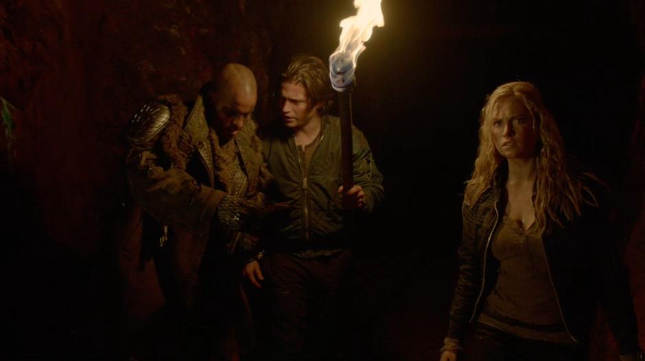 Lincoln and Finn are looking at the map when Clarke notices a light down the tunnel.