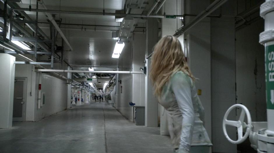 Clarke spies a whole group of guards coming down the hallway towards her.