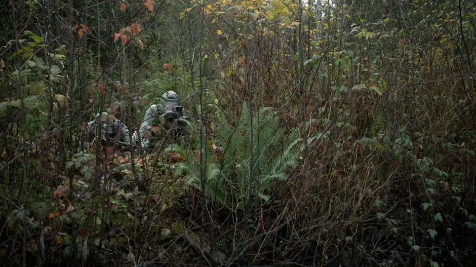 The Mount Weather sniper and his spotter take aim at Clarke.