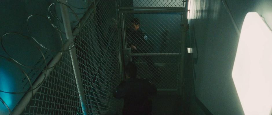 Guards rush to open a gate during Ivan Vanko's escape.