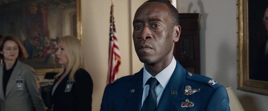 Rhodey watches as the Vice President is arrested.