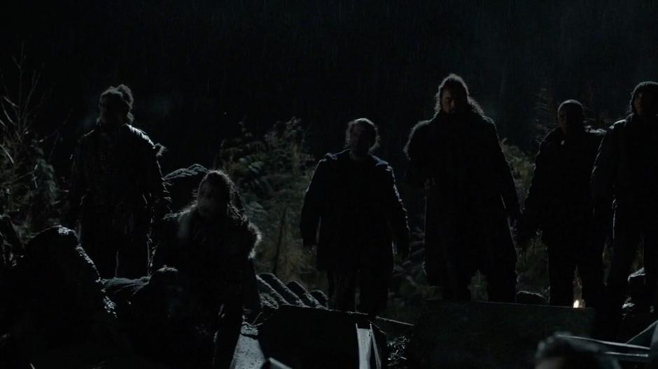 Survivors of the destruction listen to Lexa's speech.