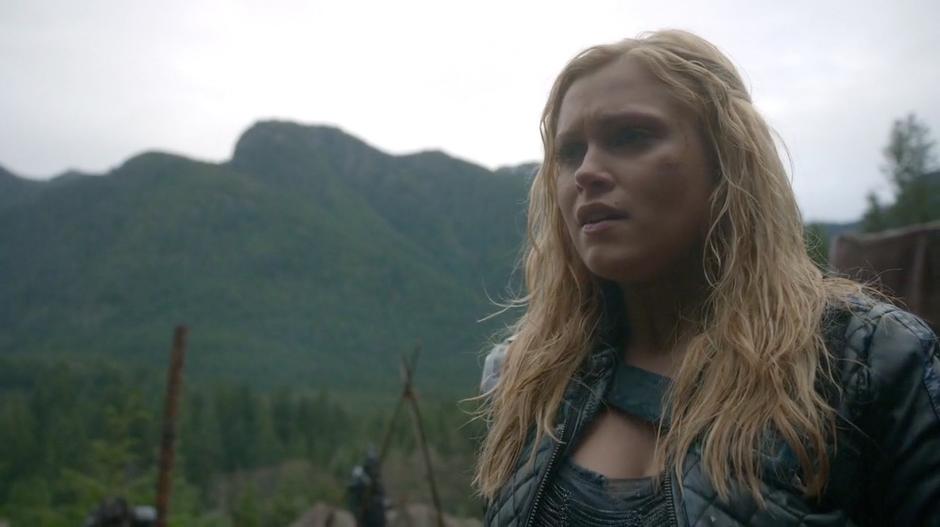 Clarke looks around the camp after having an intense conversation with Lexa.