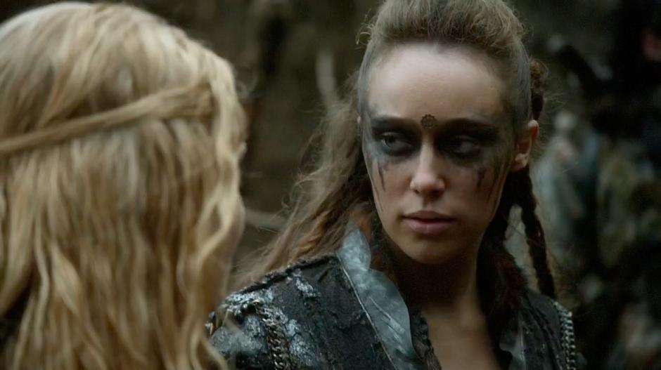 Lexa looks at Clarke after learning that Bellamy was successful.