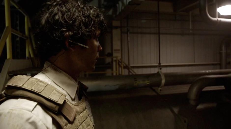 Bellamy looks over the tank of acid.