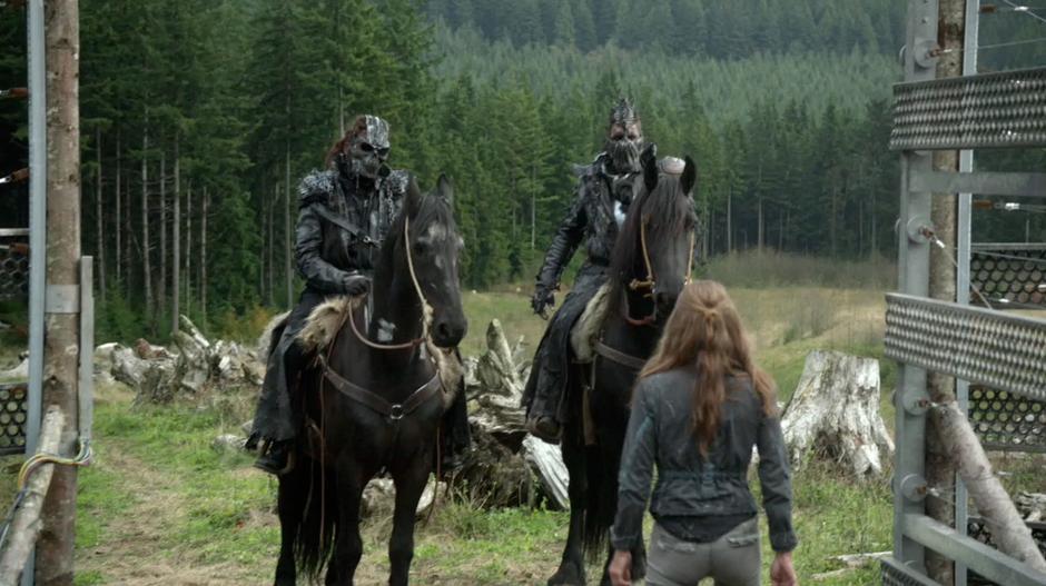 Abigail talks to the two Grounders who are waiting outside the camp for her word.