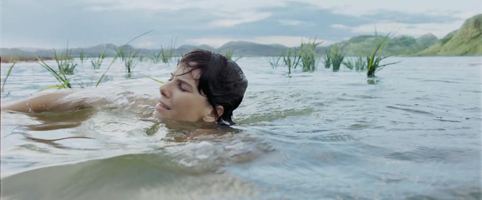 Dr. Stone swims to shore.