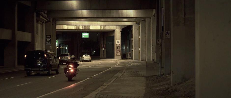 The cop begins his motorcycle pursuit after clocking Sam's speed.