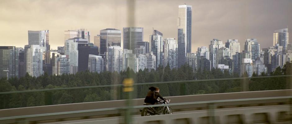 Sam and Quorra ride over the Lions Gate Bridge at the end of TRON: Legacy.