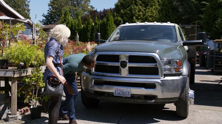 Clive examines the front bumper of the Sutcliffe's truck with Liv but he doesn't find any significant damage.