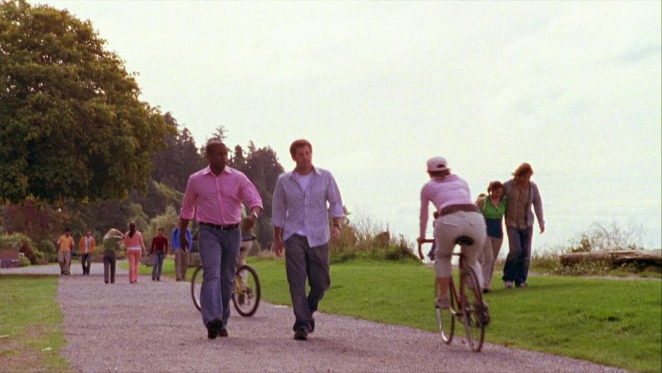 Shawn and Gus walk down the path after leaving Henry's house.