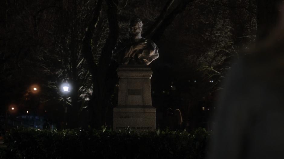 Tracy looks up at the Galileo statue.