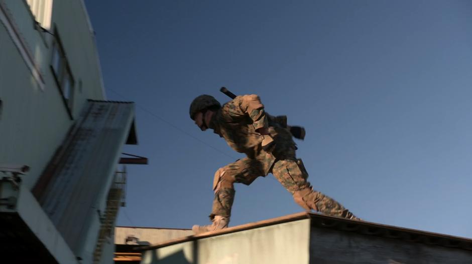 Major jumps from a dumpster to the building in some sweet parkour moves.