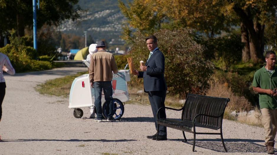 Johnny Frost stands around with an ice cream cone in one hand and the ransom envelope in the other.