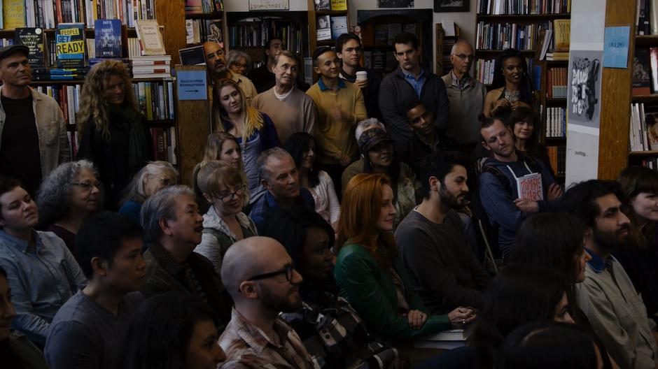 Amanita and a bunch of interested patrons listen to the two authors speak.