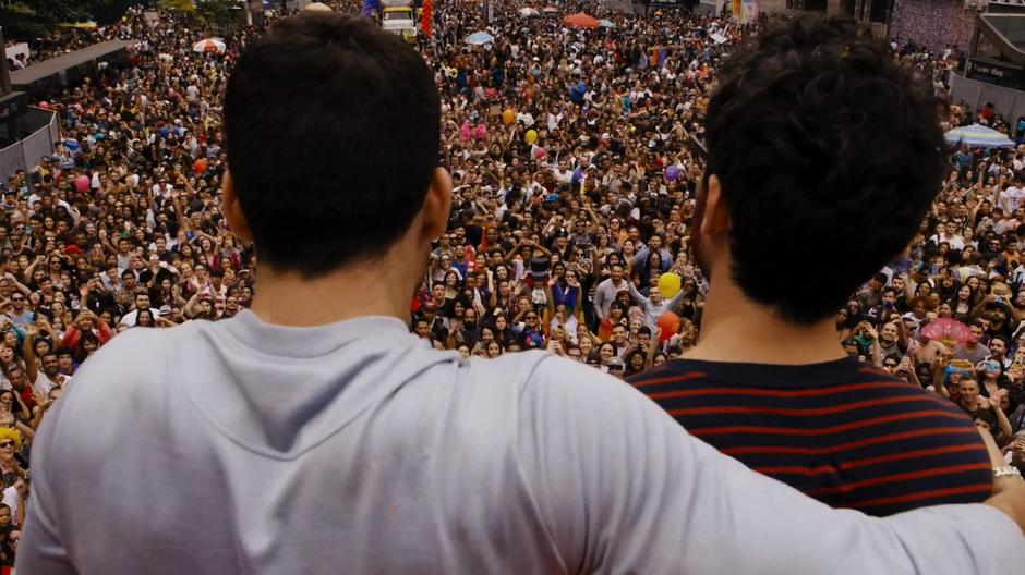 Lito looks out on the gathered masses with his arm around Hernando.