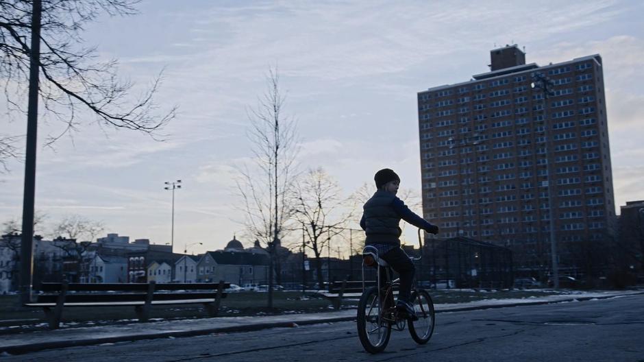 Young Will rides his bike past Sara's home.