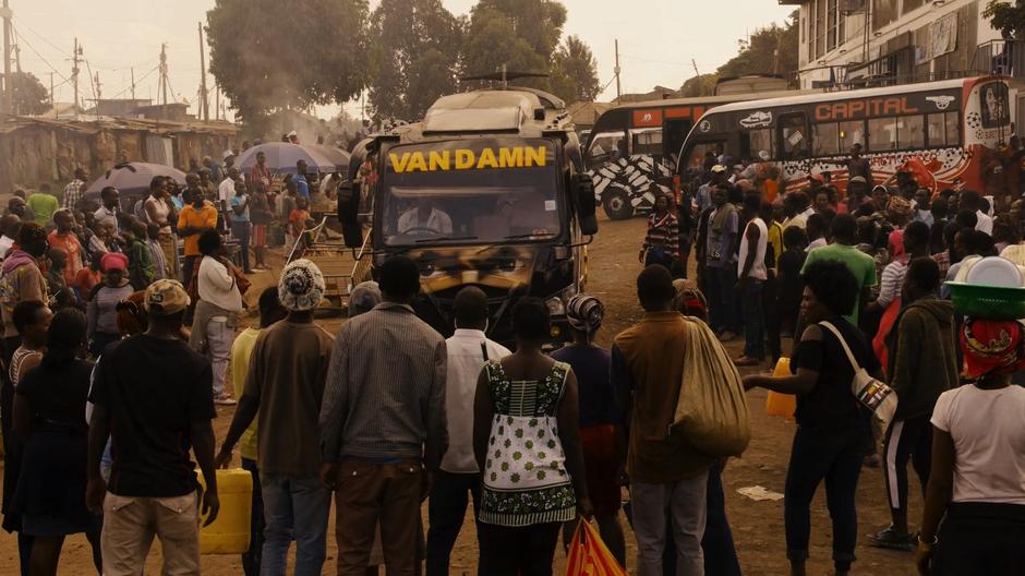 The Van Damn drives through the crowd and pulls into its parking spot.