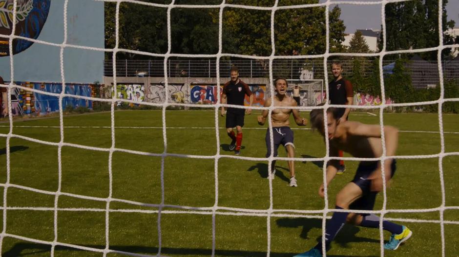 The players on Wolfgang's team celebrate after scoring a goal.