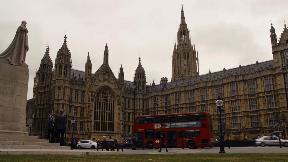 Whispers and Will look across the street at the Palace of Westminster.