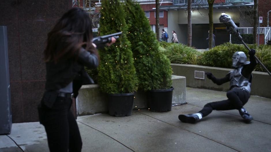 A Daxamite solider collapses after being shot with a shotgun by Maggie.