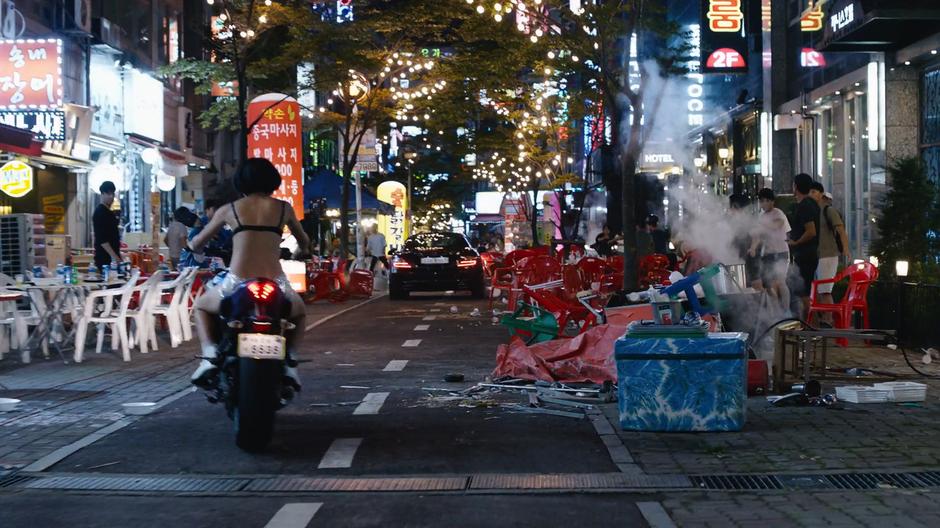 Sun follows Joong-Ki down the path of destruction he created on her motorcycle.