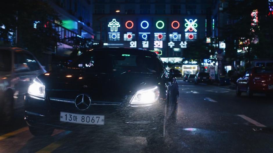 Joong-Ki's car swerves around a car through the oncoming lane.