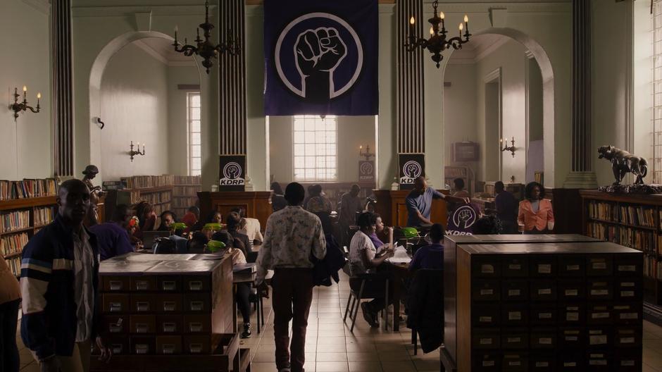 Capheus looks around the busy offices of the Kenyan Democratic Reform Party.