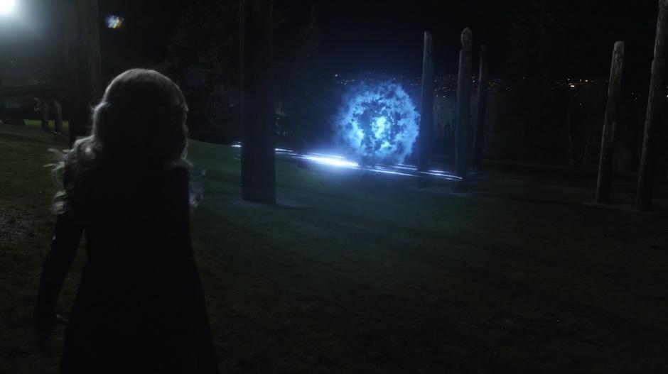 Killer Frost watches as Savitar creates the time portal needed for his ascension.