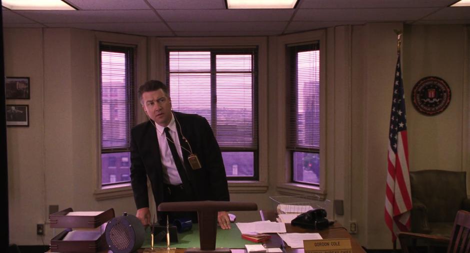 Gordon Cole leans over his desk to listen more closely to Phillip Jeffries.